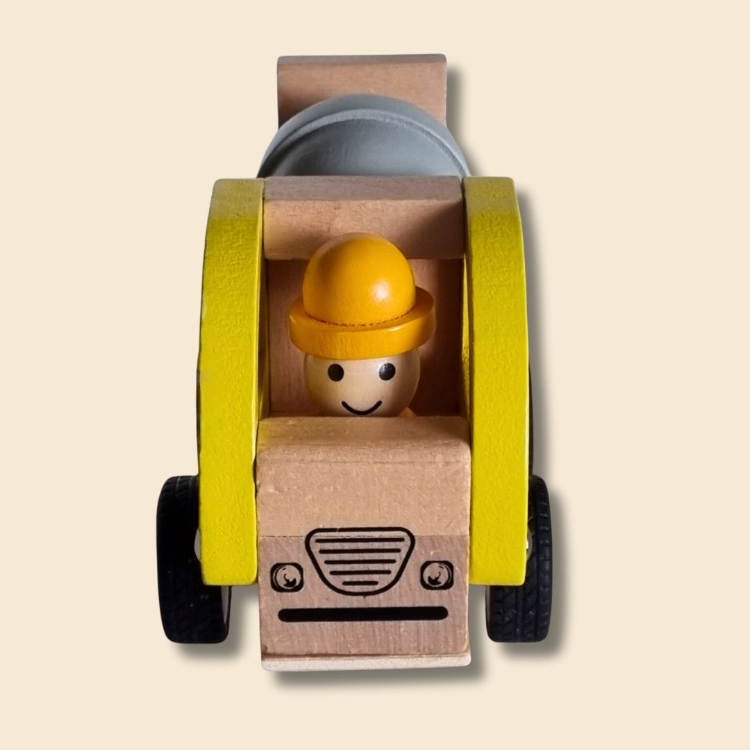 Wooden toy truck with a driver figure wearing a hard hat on a beige background