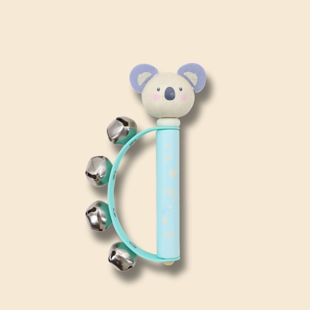 Baby handbell with light blue koala design and metal bells on a beige background
