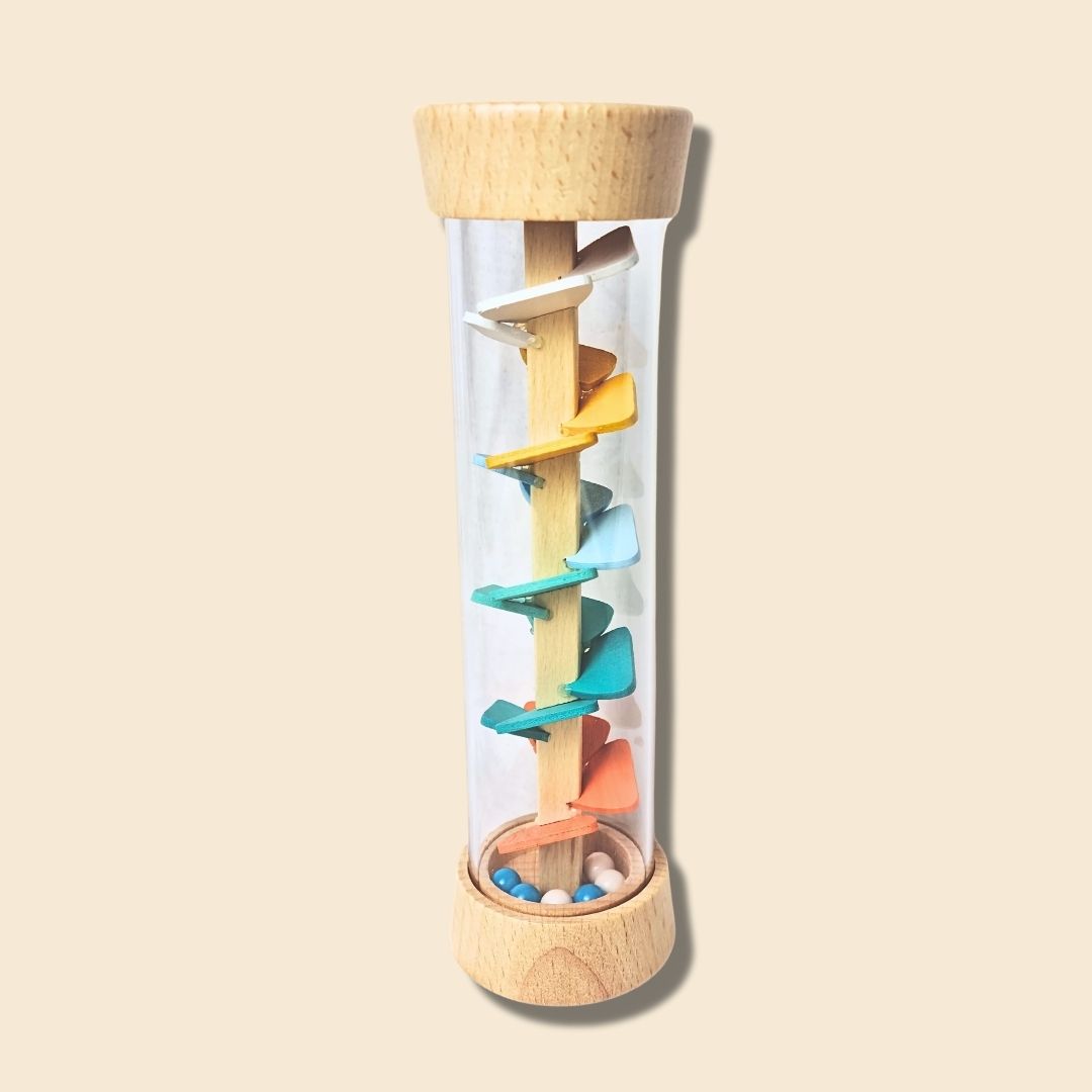 Colourful spiral interior of Whale/Octopus Rainstick made of wooden ends and a transparent tube containing the colourful wooden spiral for the beads to roll down and create a soft rain sound.