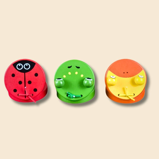 3 wooden animal castanets - red ladybug, green frog and orange/yellow duck