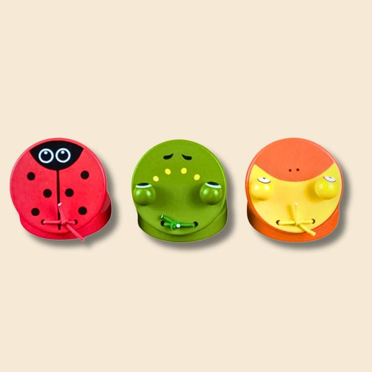 3 wooden animal castanets - red ladybug, green frog and orange/yellow duck
