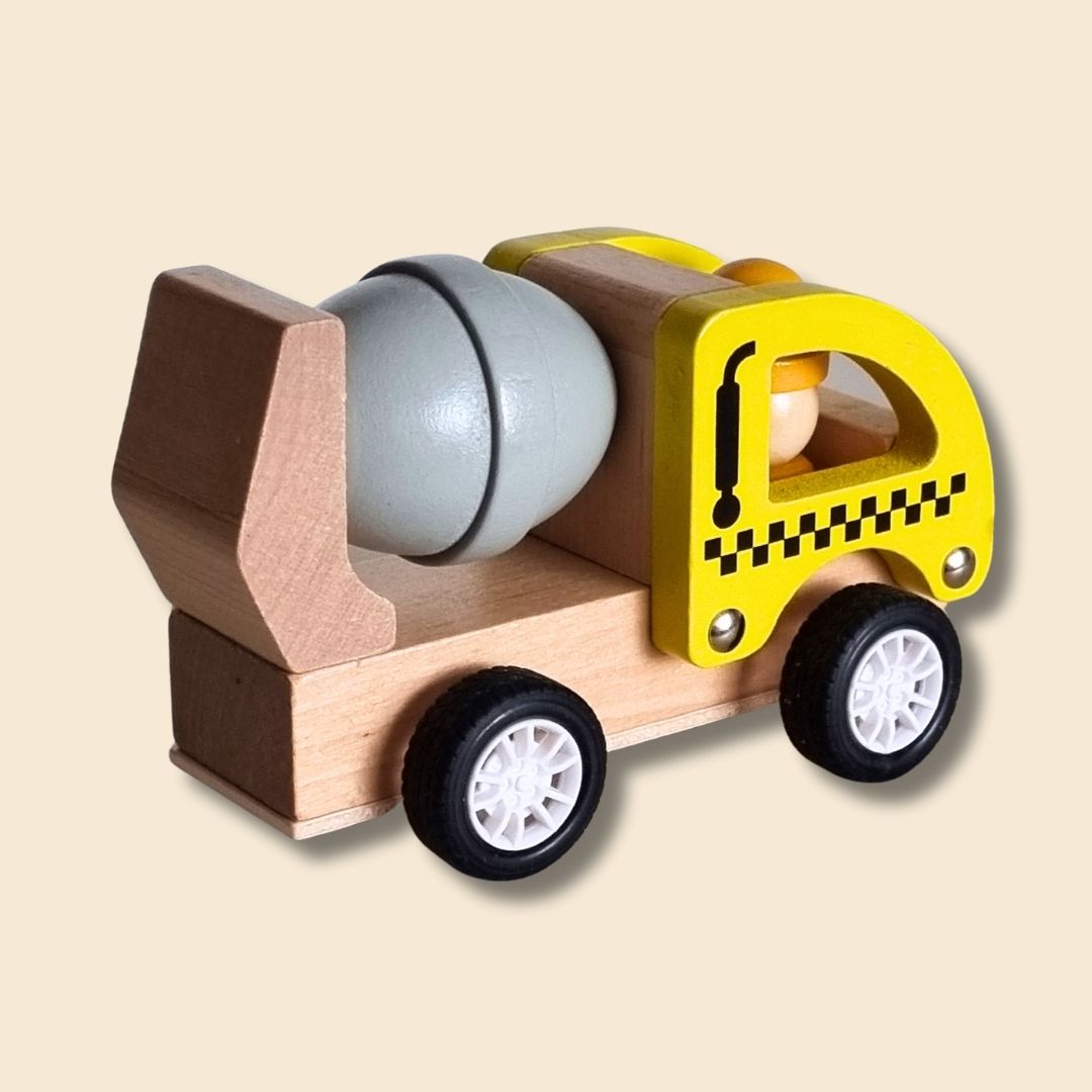 Wooden toy truck with a yellow cab and grey cement wheel on a beige background