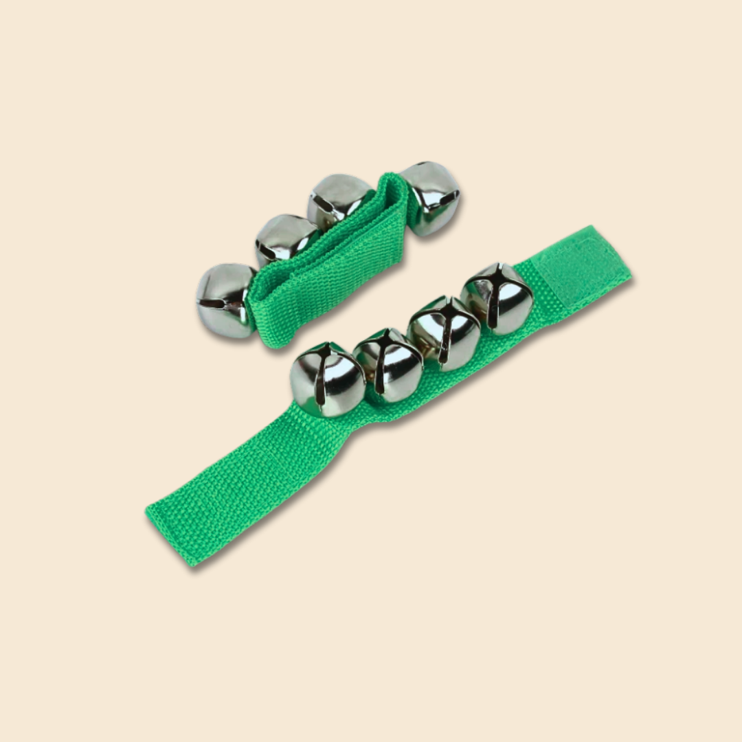 Green jingle bell straps on a beige background