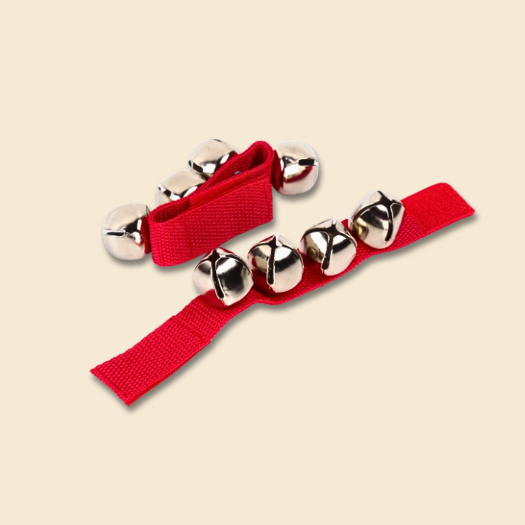 Red wristband bells accessory with silver bells ,on a beige background